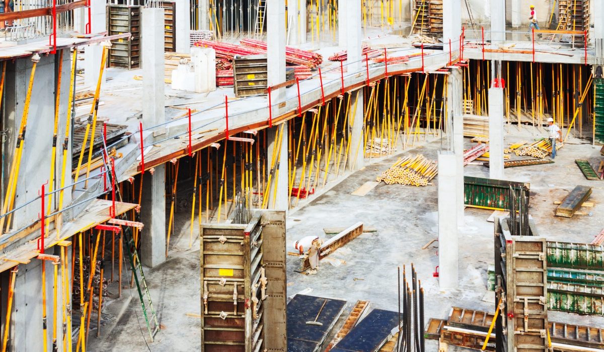 Construction work site. Building new concrete house in summer